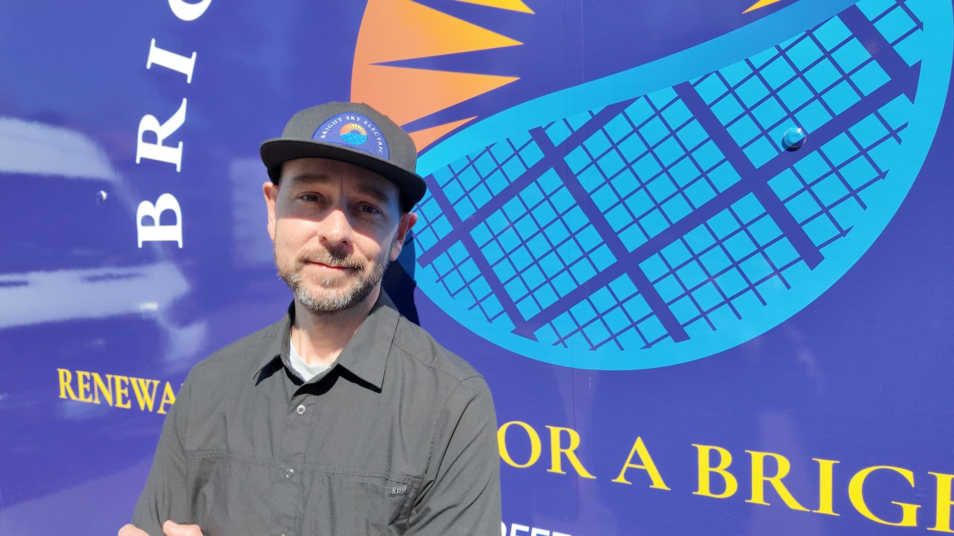 jordan and his apprentice installing solar panels